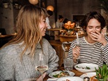 Group of friends enjoying meal together at restaurant