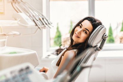 a patient at her dental appointment in Denver, CO