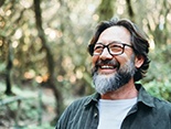 a mature man with dentures spending time outdoors