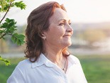 patient smiling after getting dentures 