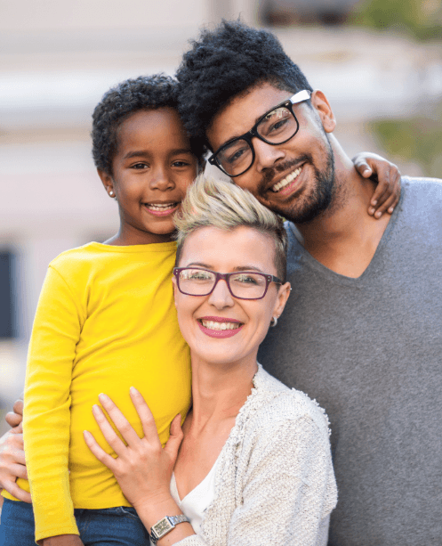 Mother father and child smiling after family dentistry