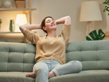 Woman relaxing on her couch