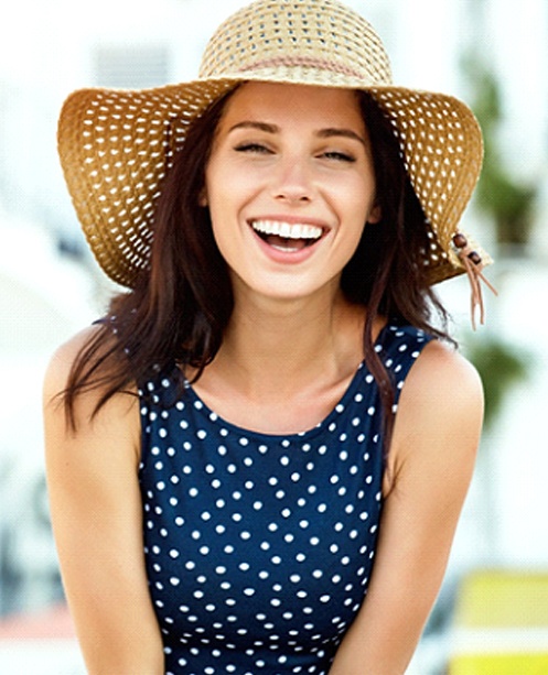 Woman smiling with Invisalign in Denver