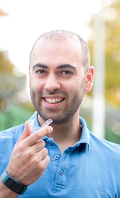 Man holding Invisalign in Denver