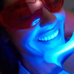 patient getting in-office teeth whitening from their cosmetic dentist in Denver, CO