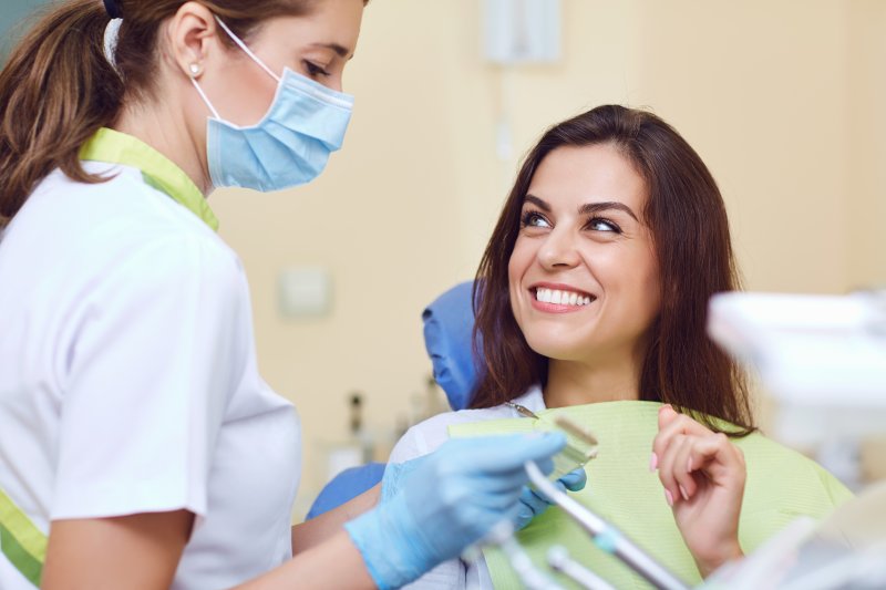 patient smiling during dental crown procedure